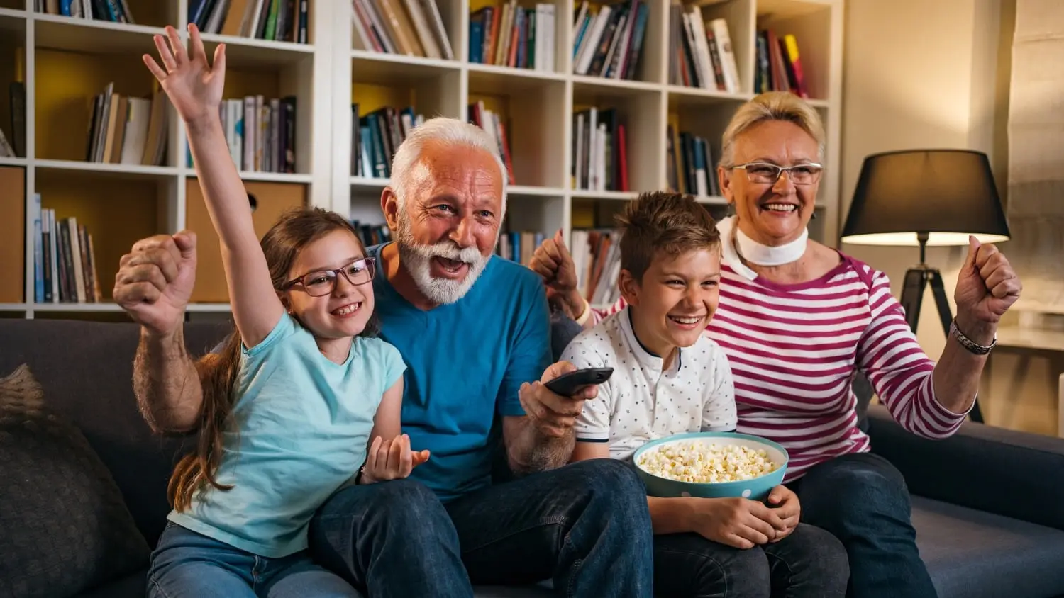 Seniors watching vseebox with grandkids
